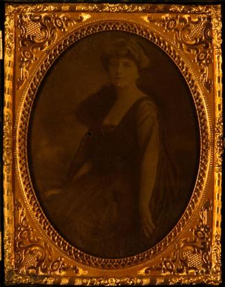 [Seated female, sheer sleeve, facing left]