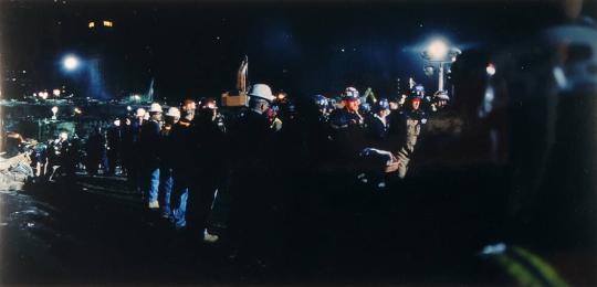 An honor guard forms as firemen bring up recovered remains