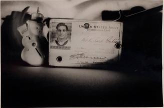 [U.S. Navy identification card with model snowman with broom]