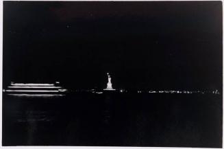 [night scene with Statue of Liberty]