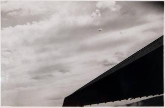 [clouds and roof of building]
