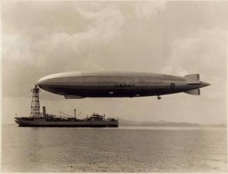 ["U.S.S. Patoka with the / La. moored to her mast / Panama Bay, 1931"]