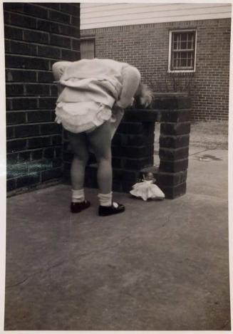 [back of little girl and doll "Taken Jan. 14, 1953"]
