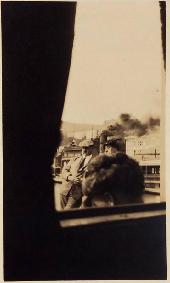 ["Mr. & Mrs. L.F. Loiselle on board S.S. Diamond through sitting room window. Aug 11 1920"]