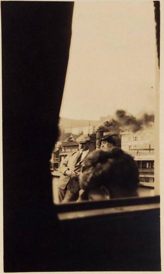 ["Mr. & Mrs. L.F. Loiselle on board S.S. Diamond through sitting room window. Aug 11 1920"]