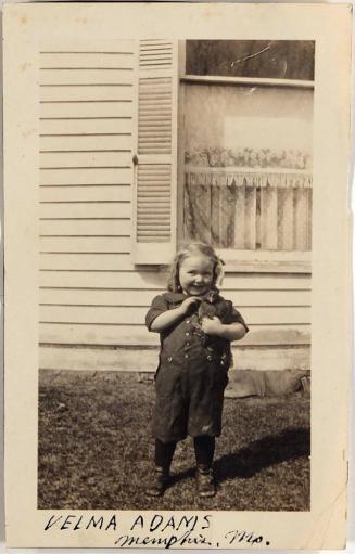 [girl with chicken in front of house "VELMA  ADAMS / Memphis, Ms."]