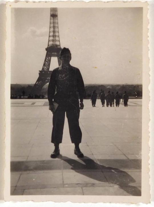 [man in military uniform standing in front of Eiffel Tower " 'Paris' / France / 1945 "]