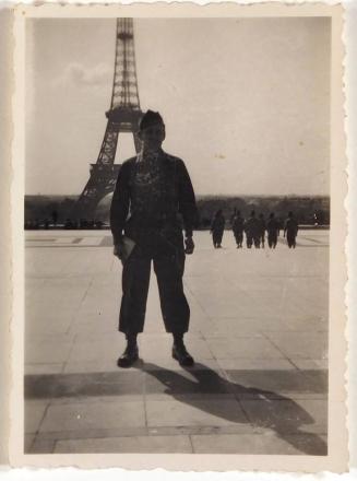 [man in military uniform standing in front of Eiffel Tower " 'Paris' / France / 1945 "]