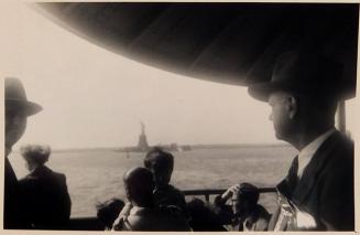 [people looking out from ferry boat towards Statue of Liberty "9/23/51 / Staten Island Ferry, / New York"]