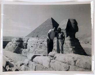 [two men with arms around each other in front of sphinx and pyramid "Cairo. Nov. 17, 1959..."]