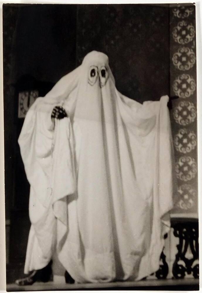 person dressed as ghost with sheet and eye holes cut out] | All 