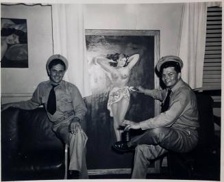 [two men in military uniform sitting in front of a painting of a semi nude woman]
