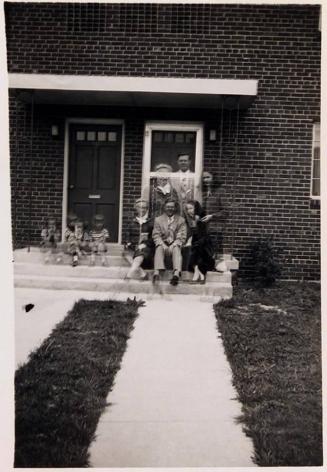 [people on front steps of building]