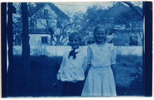 [boy and girl in yard]