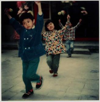 [children dancing with flowers]