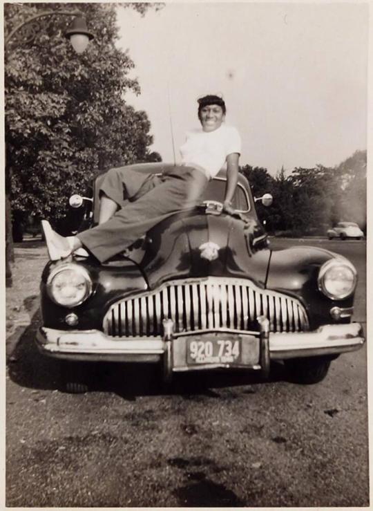 [woman on car]