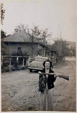 [woman with dead pheasants and rifle "40 BUICK"]