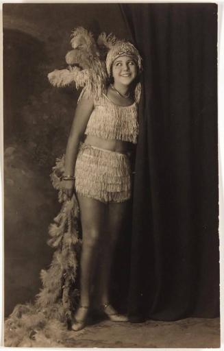 [postcard- young woman in costume "GINA 14"]