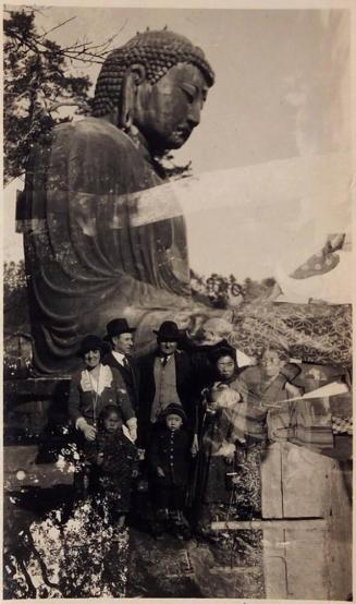 [double exposure- people in front of large Buddha statue]