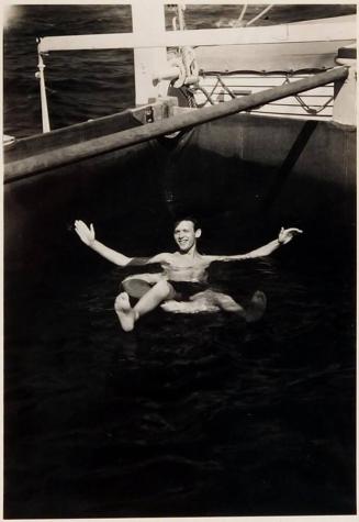 [man floating in life preserver in water "May 1935"]