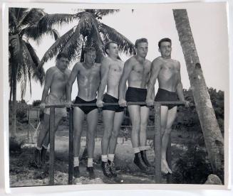 [5 men holding themselves up on metal parallel bars]