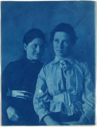 [two young women in dresses]