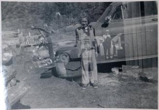 [double exposure of child with multiple cars]