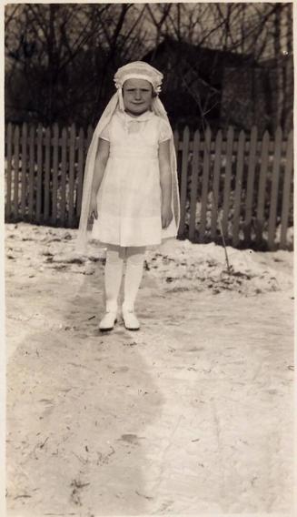 [young girl in 1st Communion outfit]