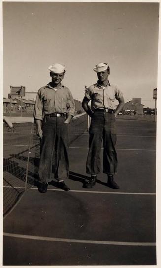 [two men in uniform on tennis court]