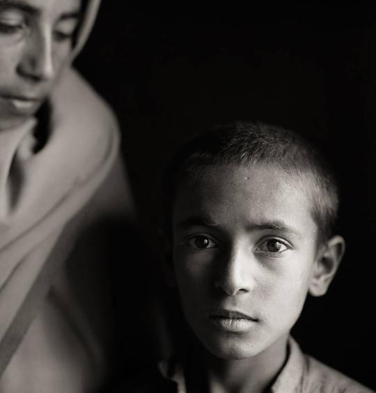 Brothers, born in exile, Afghan refugee village, Khairabad, North Pakistan