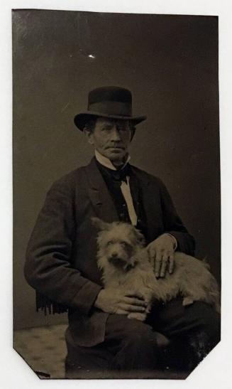 [Man with Dog in Lap]