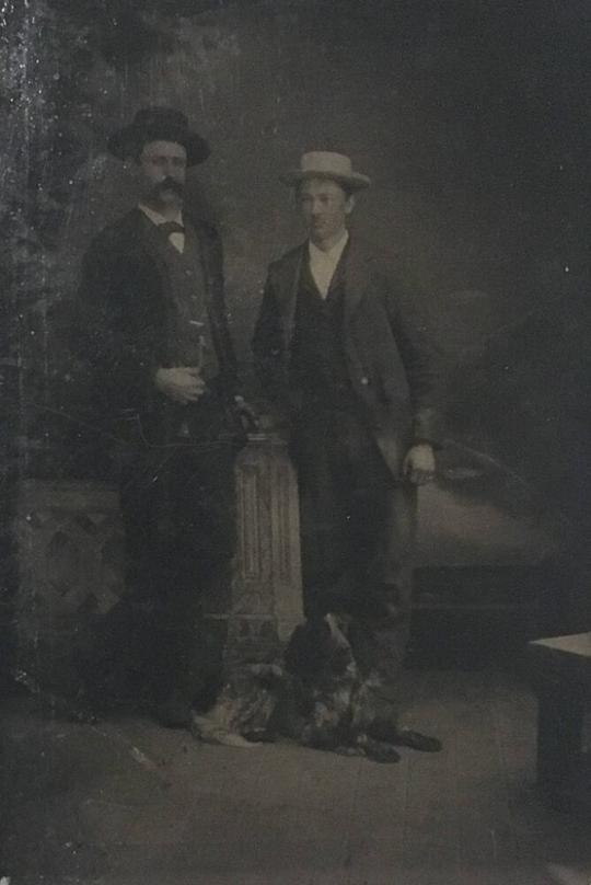 [Two Men with Dog]