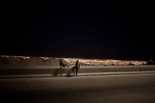 Manny and Alejandro jump across the newly lit section of Camino