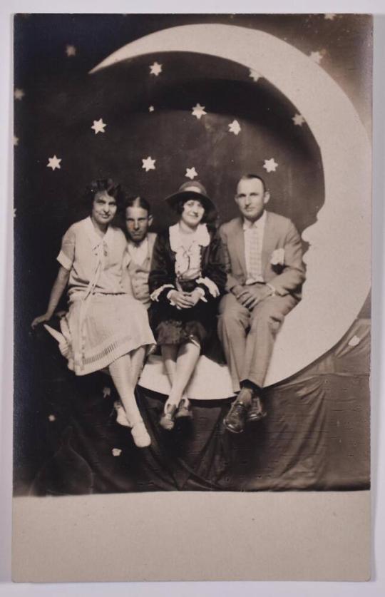 [Group Posing with Large Paper Moon and Stars]