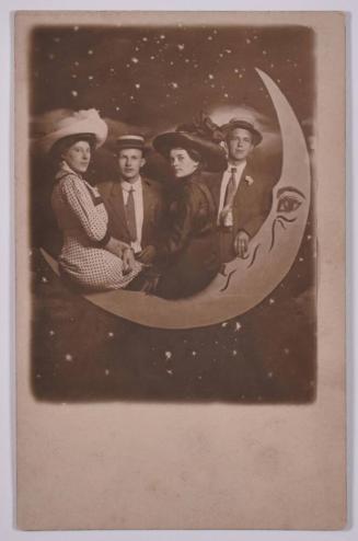 [Group Posing with Large Paper Moon and Stars]