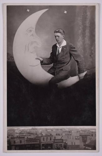 [Young Man Posing with Large Paper Moon and Stars]