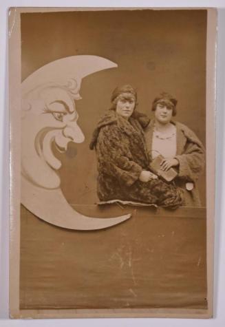 [Two Women Posing with Large Paper Moon and Stars]