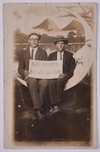 [Two Young Men with a Sign Posing with Large Paper Moon and Stars]