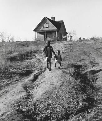Children of tenant farmer, younger one with severe rickets, from malnourishment. Land worn out from cotton-tobacco culture, near Wadesboro, North Carolina