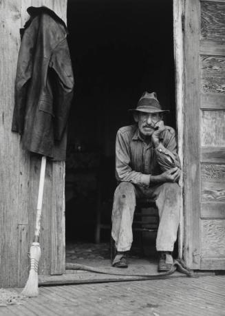 Father of Muskrat Trapper, in Doorway of Shack on Bayou.  Trapper was an FSA Client (Borrower)