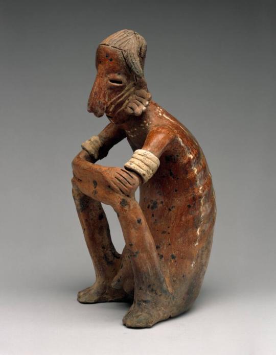 Emaciated Seated Man