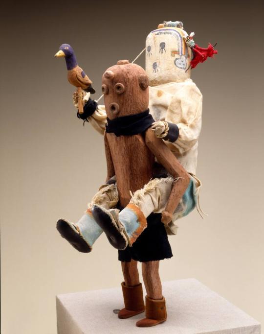 Mudhead (Koyemshi) Figure Carrying the All Wise (Kyaklu) Kachina Figure