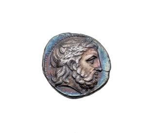Coin: Tetradrachm of Philip II with Head of Zeus laureate on the obverse; victorious horse and rider on the reverse
