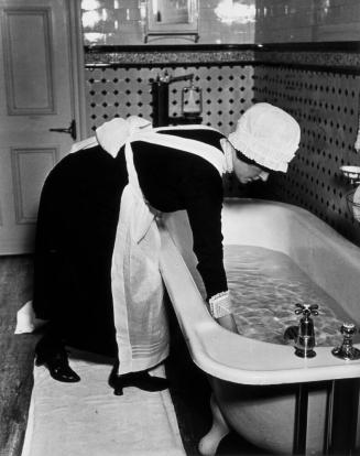 Parlourmaid Preparing a Bath before Dinner