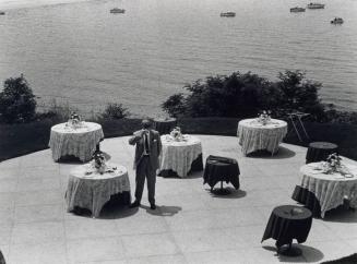 Man on Patio Drinking