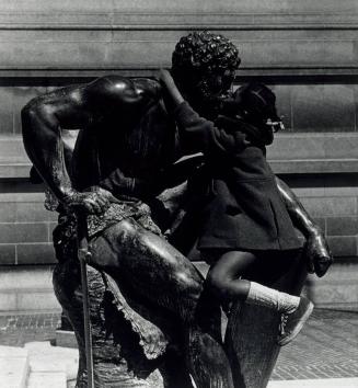 Girl Kissing Statue