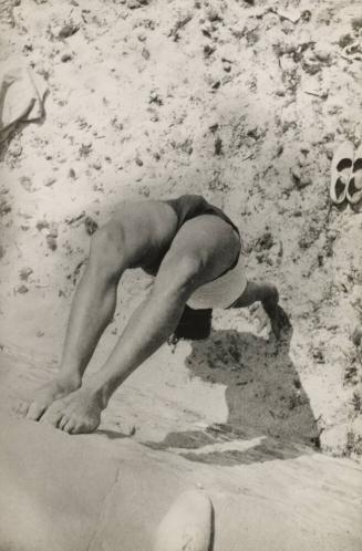 Xanti Schavinsky in a Handstand Position