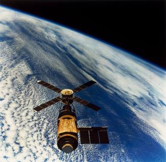 Mission: Skylab 3: The Skylab, United States first manned, orbiting space station labratory, as seen by departing astronauts Jack R. Lousma, Owen K. Garriott, and Alan L. Bean.