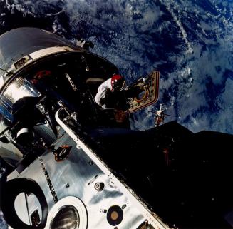 Mission: Apollo-Saturn 9 — Rehearsing for future lunar landings, David R. Scott begins extravehicular activities to test the performance of the lunar module in earth's orbit