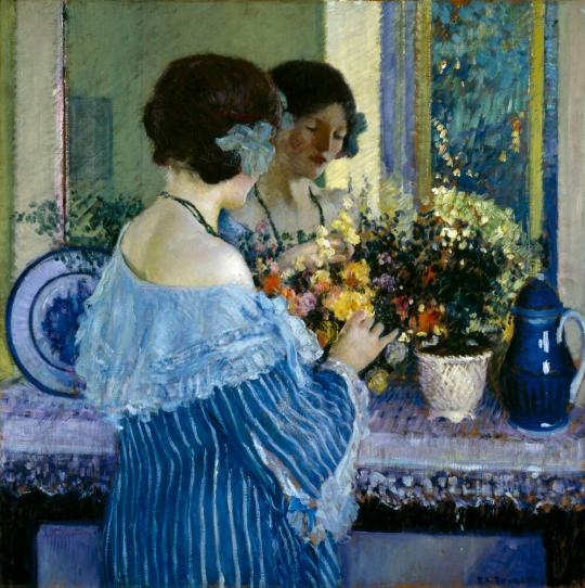 Girl in Blue Arranging Flowers